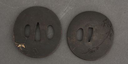 null Two tsuba maru-gata, one decorated in takazogan and gold highlights, with two...