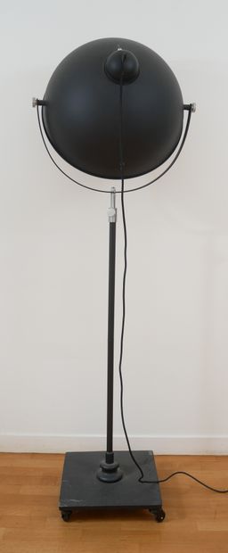 null Studio lamp made up of a black lacquered metal projector, tubular shaft on a...