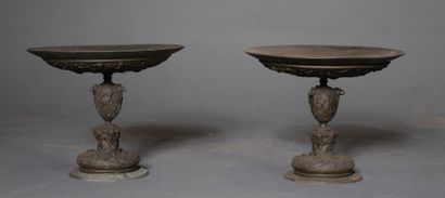 null *A pair of patinated metal display stands with relief decoration in the Renaissance...
