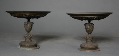 null *A pair of patinated metal display stands with relief decoration in the Renaissance...