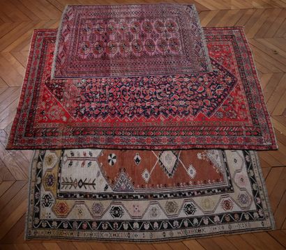 null Three mismatched wool rugs