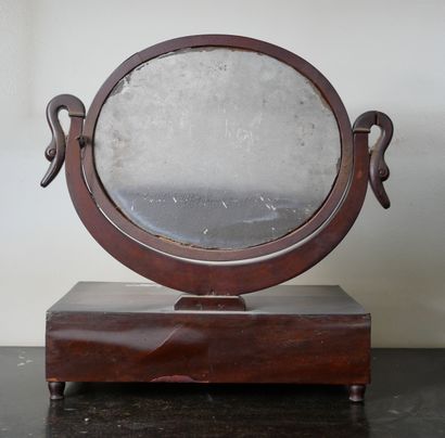 null Mahogany veneer table top with a drawer in the belt and an oval mirror held...