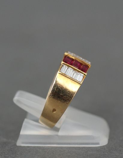 null Ring in 18k yellow gold set with three lines of calibrated diamonds and two...