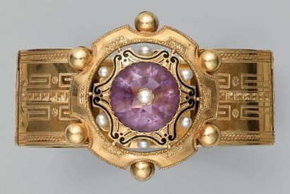 null Bracelet articulé en or jaune décoré de grecques, le centre orné d'un motif...