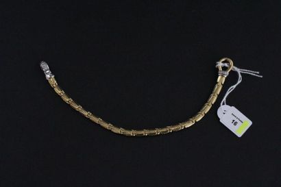 null Bracelet articulé en or jaune et gris partiellement serti de petits diamants....