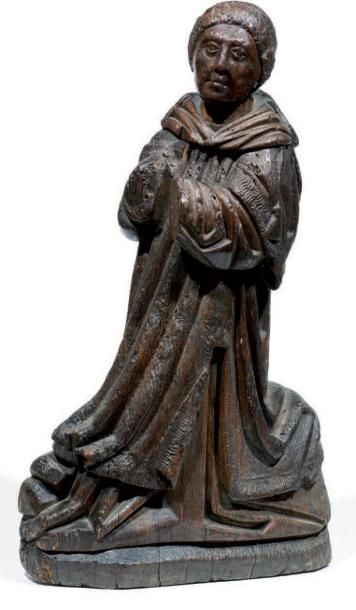 null Sculpture en bois du XVIe siècle d'un moine. Il est représenté à genoux de profil,...