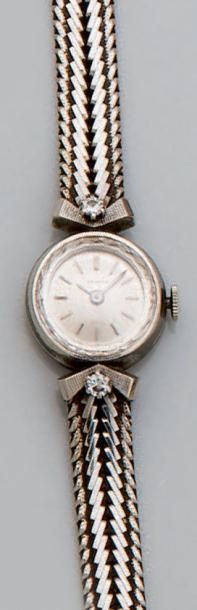 null Montre-bracelet de dame en or gris, la montre de forme ronde, index bâtonnets,...