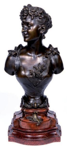 D'après Eutrope BOURET (1833-1906) «Premier bal» Buste en bronze à patine brune représentant...