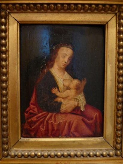 Ecole XIXème s. "Vierge à l'enfant" Huile sur panneau dans un cadre en bois doré...