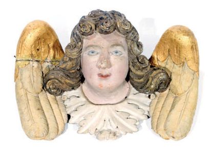 null Tête d'ange en bois sculpté, doré et polychromé. XVIIIème siècle (relaqué)....