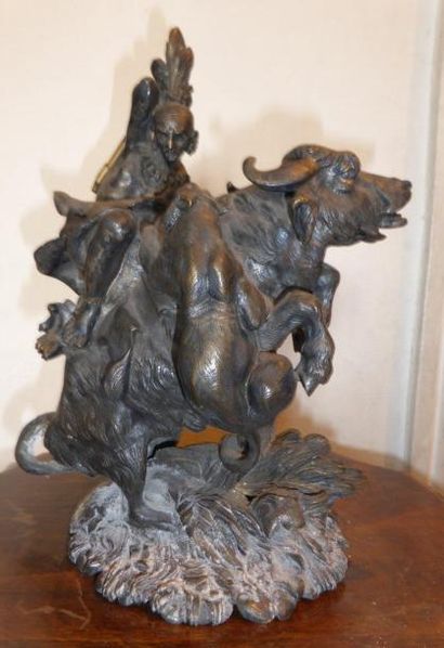 null Sculpture en bronze patiné représentant un indien d'Amérique et son chien attaquant...