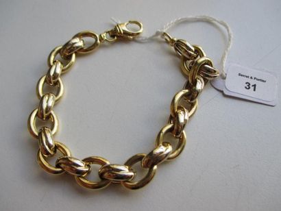null Bracelet articulé en or jaune 18K 750 millièmes, les maillons de forme ovale....