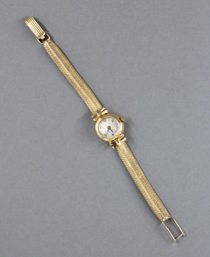 null Bracelet-montre de dame en or jaune 18k, pds brut : 18,4 g.