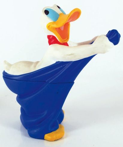 null DONALD DUCK Figurine en plastique souple et rigide représentant Donald une serviette...