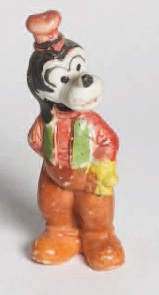 null GOOFY Figurine en porcelaine peinte illsutrant Goofy debout une main au dos...