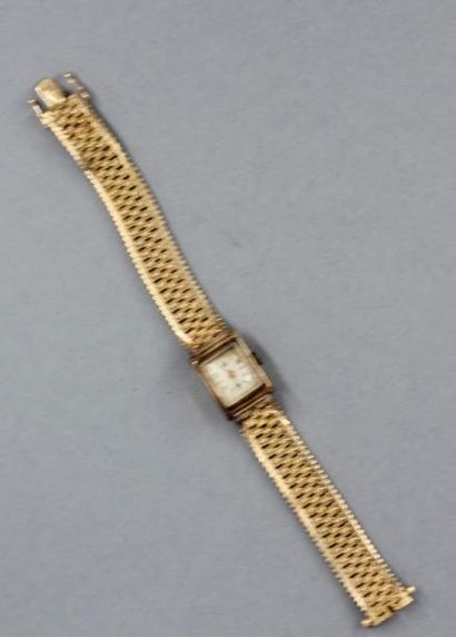 null Bracelet-montre de dame en or jaune 18k, pds brut : 39,5 g.