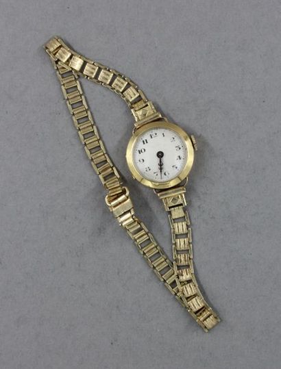 null Bracelet-montre de dame à boitier rond en or jaune 18k et bracelet en métal...