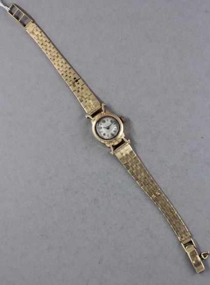 null Bracelet-montre de dame à boitier rond en or jaune 18k, pds brut : 27,4 g. (légers...