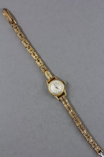 null OMEGA Bracelet-montre de dame, boitier rond en or jaune 18k et bracelet en métal...