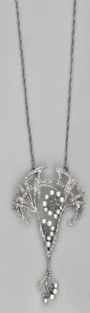 null Collier articulé en or gris, supportant un pendentif à décor de fleurs, orné...