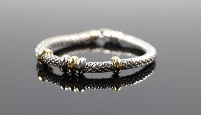 null Bracelet souple en or gris, orné de cinq anneaux glissants en or jaune et gris.

Travail...