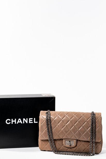 null CHANEL.

Large 2.55 bag in quilted taupe aged calf leather, aged palladium clasp...