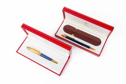 null CARTIER, the Must.

Meeting of two pens in their cases, including : 

- Ballpoint...
