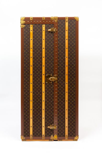 null 
*LOUIS VUITTON, Paris.




Wardrobe trunk in monogram coated canvas, gilded...