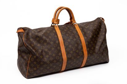 null LOUIS VUITTON.

Keepall" travel bag in coated monogram canvas and natural leather...