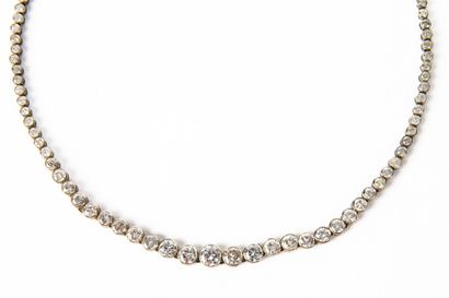 null White gold river necklace holding one hundred and twenty-three modern-cut round...