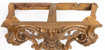 null Carved, openwork and gilded wood console, the belt decorated with garlands and...