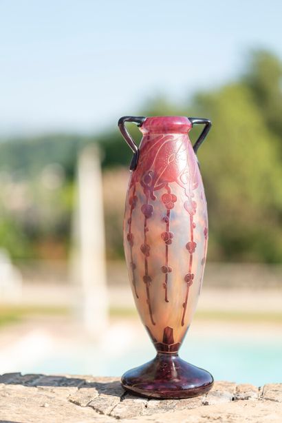 null FRENCH GLASS.

Baluster vase with flattened base in multi-layered glass with...