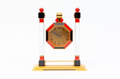 null HOUR LAVIGNE, Paris.

Octagonal table clock with a red and black dial imitating...