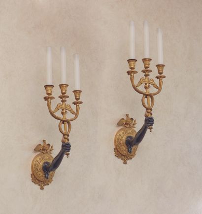 
A pair of sconces in green patina bronze...