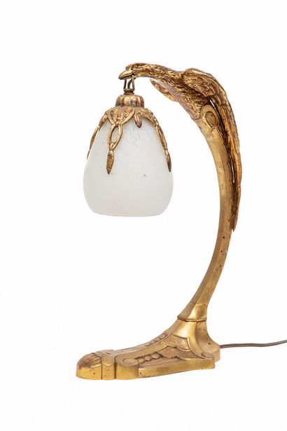 null Charles RANC (XIXème-XXème).

Lampe de bureau à pied en bronze ciselé et doré...