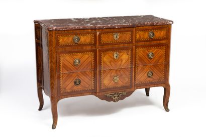 null Chest of drawers with a slight central projection in rosewood marquetry in frames...