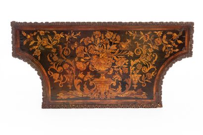 null Carved walnut console with rich decoration of flowers and scrolls.

The four...