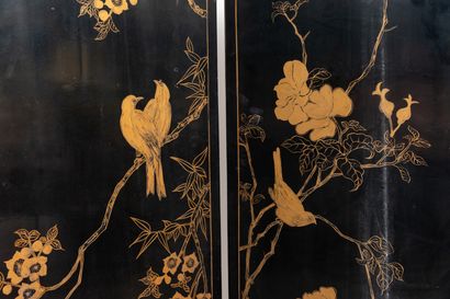 null CHINA, 20th century. 

Four-leaf screen in black and gold lacquer and hard stone...