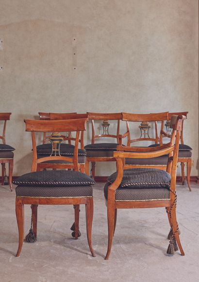 null 
A suite of two armchairs and six chairs, the backs openwork with black and...
