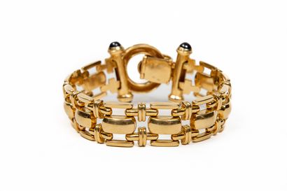 null Yellow gold bracelet composed of articulated links, the clasp decorated with...