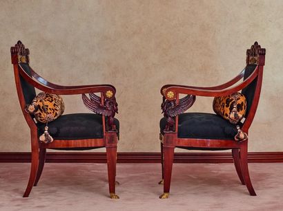 null 
A pair of mahogany and mahogany veneered armchairs with ormolu ornaments, the...