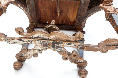 null Carved walnut console with rich decoration of flowers and scrolls.

The four...