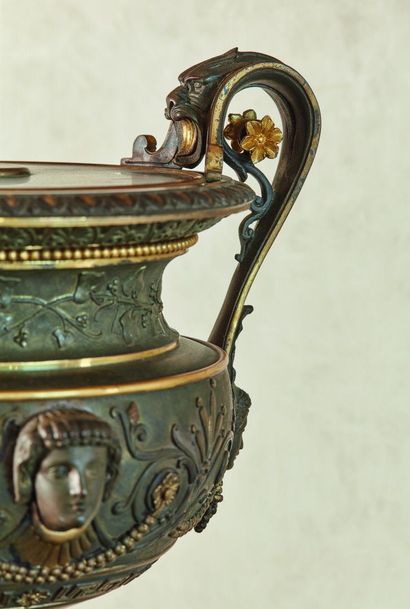 null 
A pair of bronze and marble cassolettes, with two handles, decorated with Etruscan-style...
