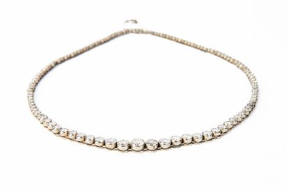 null White gold river necklace holding one hundred and twenty-three modern-cut round...
