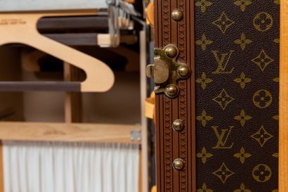 null 
*LOUIS VUITTON, Paris.




Wardrobe trunk in monogram coated canvas, gilded...