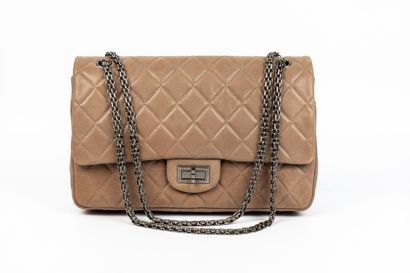 null CHANEL.

Large 2.55 bag in quilted taupe aged calf leather, aged palladium clasp...