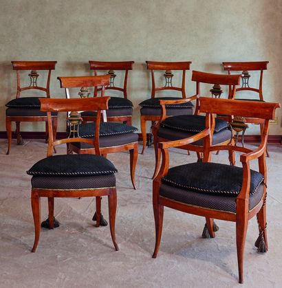 null 
*Suite de deux fauteuils et six chaises, les dossiers ajourés à décor laqué...