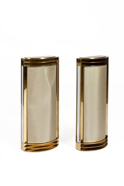 null Pair of modernist wall sconces in brass.