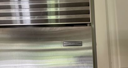 null SUB-ZERO. 

Triple unit with two refrigerators and a wine cellar, stainless...