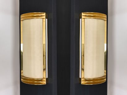 null Pair of modernist wall sconces in brass.